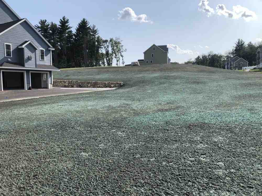garden with stone retaining wall and built-in seating - hardscape services