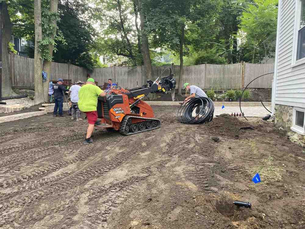 stone patio and walkway in backyard - hardscaping vs softscaping