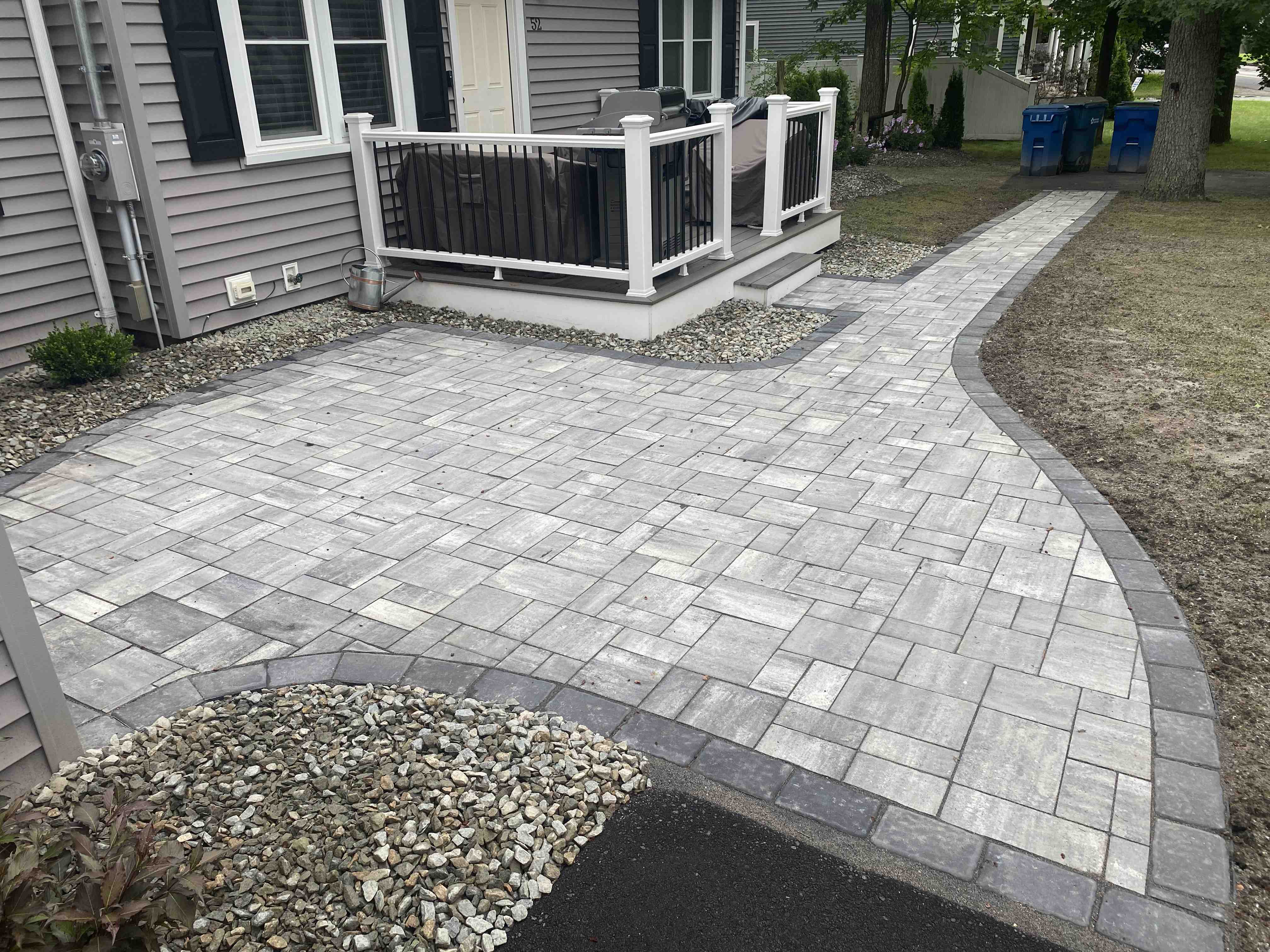 Functional outdoor space with patio and walkway - hardscaper